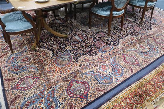 A Persian blue ground carpet, 13ft 1in by 9ft 8in.